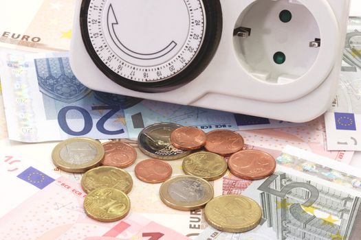 24 hours mechanical timer with Euro coins and bills