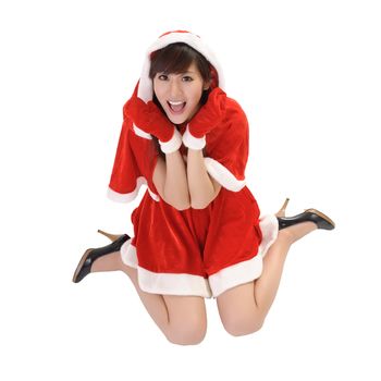 Happy Christmas girl with smiling expression on face sit on studio white ground.