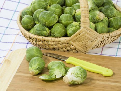 Preparation of brussels sprouts on a wooden plate