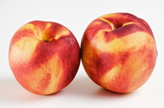 pair of ripe nectarines