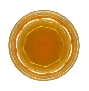 Top view of a glass of whisky isolated in white