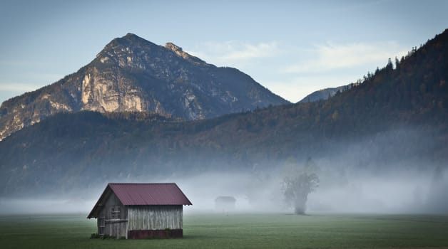 An image of a beautiful landscape with fog in bavaria germany