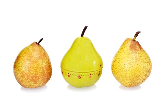 Two ripe fresh pears and plastic pear timer (stand out of the crowd concept)