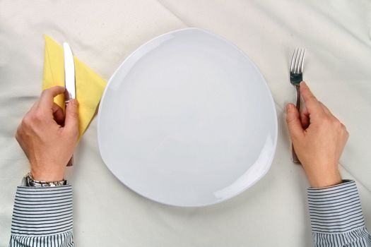 Man waiting near an empty plate