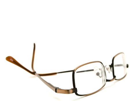 modern glasses in metallic frame over the white background