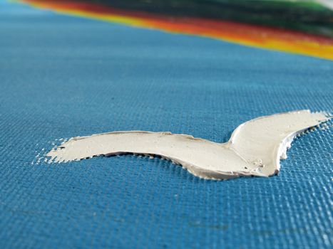 Painted abstract bird in the sky on canvas (macro prospective).