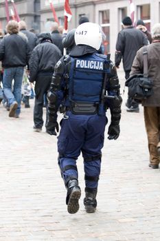 Riga, Latvia, March 16, 2009. Riot police observing Commemoration of the Latvian Waffen SS unit or Legionnaires.The event is always drawing crowds of nationalist supporters and anti-fascist demonstrators. Many Latvians legionnaires were forcibly called uo to join the Latvian SS Legion.