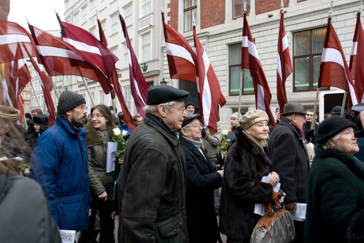 Riga, Latvia, March 16, 2009. Former veterans of the Latvian Legion and their families leaving Dome churche after service to the Freedom monument. Commemoration of the Latvian Waffen SS unit or Legionnaires is always drawing crowds of nationalist supporters and anti-fascists. Many Latvians legionnaires were forcibly called to join the Latvian SS Legion.