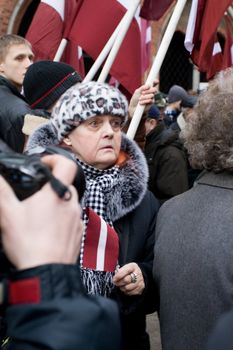 Riga, Latvia, March 16, 2009. Former veterans of the Latvian Legion and their families leaving Dome churche after service to the Freedom monument. Commemoration of the Latvian Waffen SS unit or Legionnaires is always drawing crowds of nationalist supporters and anti-fascists. Many Latvians legionnaires were forcibly called to join the Latvian SS Legion.