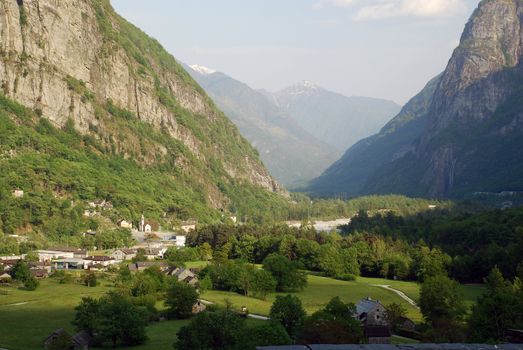 Maggia valley seen from Cevio, Visletto village at lefr side, mountains with snow at top and the sky at the background