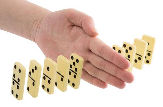 Bones of dominoes and hand on the white background