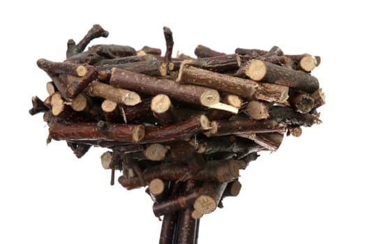 Decorative nest made of wood sticks isolated on white background.