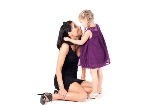 Beautiful portrait of happy cheerful woman with little girl in embrace