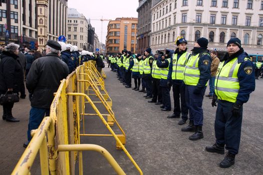 Riga, Latvia, March 16, 2009. Crowd control barriers around the Freedom Monument. Commemoration of the Latvian Waffen SS unit or Legionnaires.The event is always drawing crowds of nationalist supporters and anti-fascist demonstrators. Many Latvians legionnaires were forcibly called to join the Latvian SS Legion.