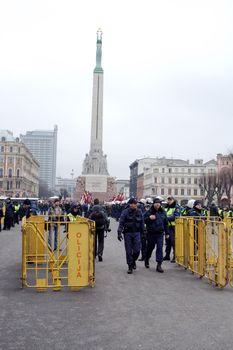 Riga, Latvia, March 16, 2009. Crowd control barriers around the Freedom Monument. Commemoration of the Latvian Waffen SS unit or Legionnaires.The event is always drawing crowds of nationalist supporters and anti-fascist demonstrators. Many Latvians legionnaires were forcibly called to join the Latvian SS Legion.