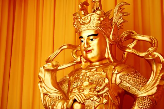 tradition chinese male buddha with gold toned
