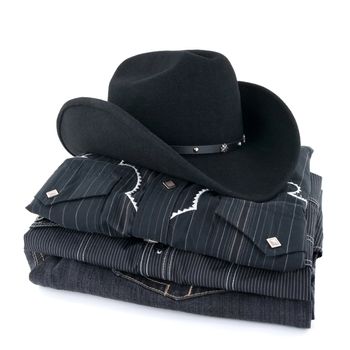Black cowboy hat and western style clothing on white background.