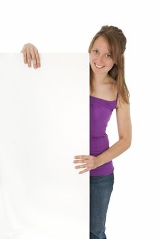 Casual young women holding a blank banner ad, smiling. Isolated on white.