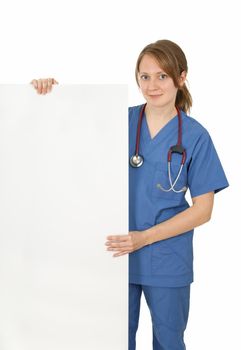 Friendly nurse in uniform holding blank banner, isolated on white.