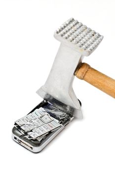 Meat tenderizer smashing cellular phone isolated on the white background