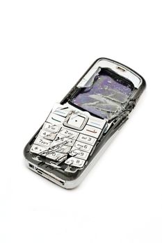 Smashed cellular phone isolated on the white background