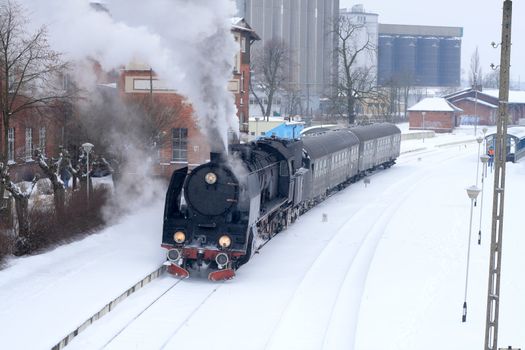 Old retro steam train stopped at the station