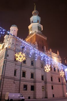 Old market square during the snowy night in poznan, poland