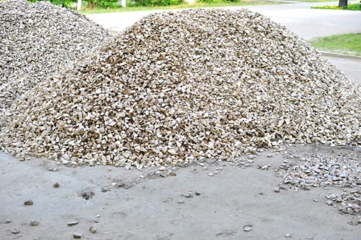 heap of gravel on road to city