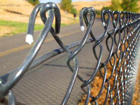 Close up of a chain link fence showing unique pattern.