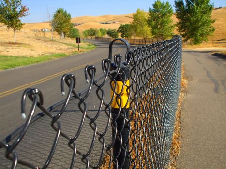 Close up of a chain link fence showing unique pattern.