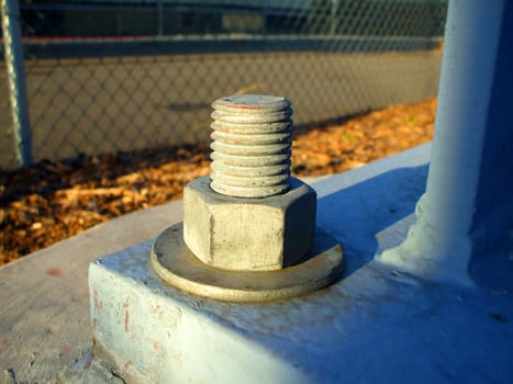 Close up of a concrete bolt.