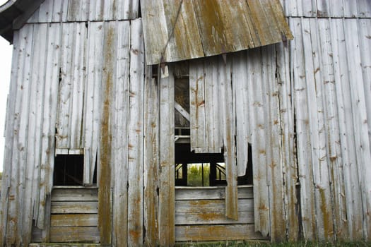 Fragment of farm barn with maize soy and wheat fields  