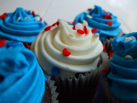 Close up of a group of cupcakes.