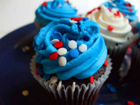 Close up of a group of cupcakes.