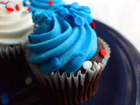 Close up of a group of cupcakes.