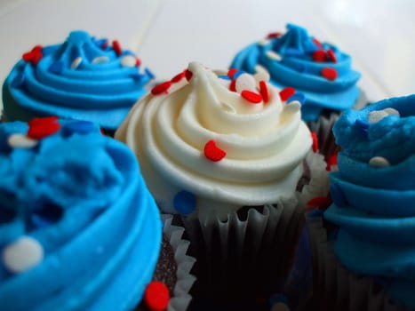 Close up of a group of cupcakes.