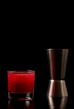 A fancy designer shot together with a measuring cup