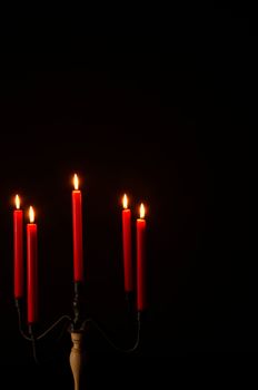 Five armed candlestick, romantic atmosphere on black with copy space