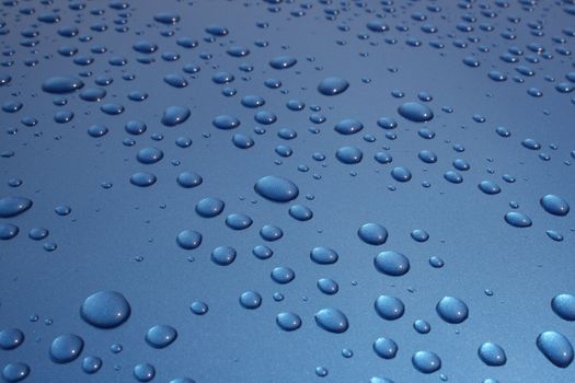 Water drops beading on a highly polished car bonnet