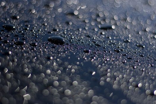Water drops beading on a highly polished car bonnet