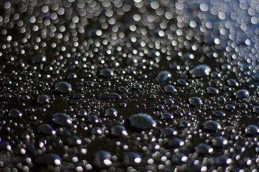 Water drops beading on a highly polished car bonnet