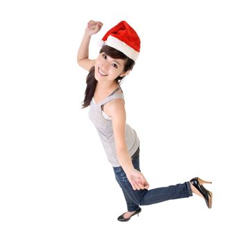Cheerful Asian woman dancing with Christmas hat.