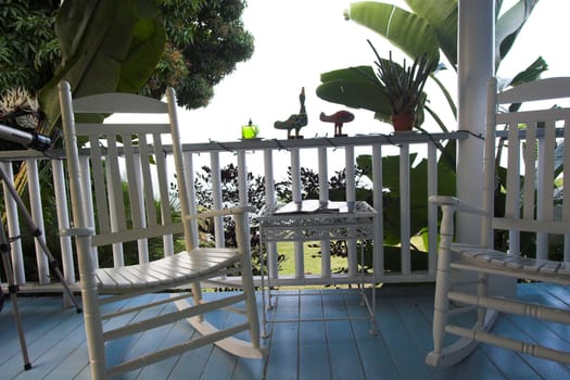 White balcony and plants in Hawaii exotic setting