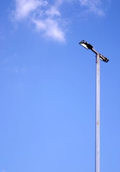 large street lamp against a blue sky