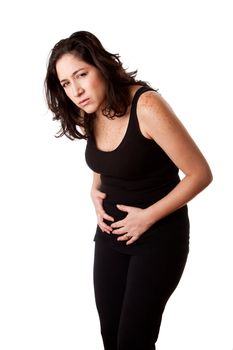 Beautiful woman holding her belly with pain and stomach cramps ache,wearing a sporty black tank top, isolated.