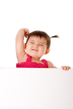 Beautiful cute baby infant with muscle arm expressing power strength and frowning face holding white board, isolated.