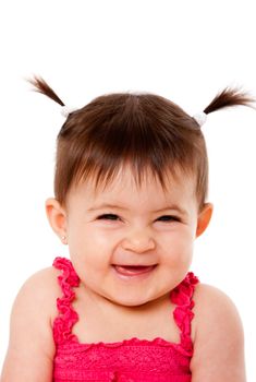 Face of cute happy smiling laughing baby infant girl with ponytails giggling, isolated.