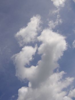 clouds in the shape of a person with its finger infront of its mouth concept secret