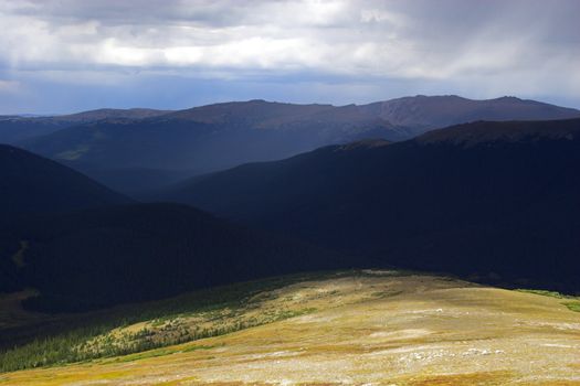 Rain and thunderclouds in the mountains tundtra prairies forests of Cordeliers 