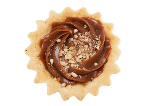 A pastry with nuts isolated over white. Top view.